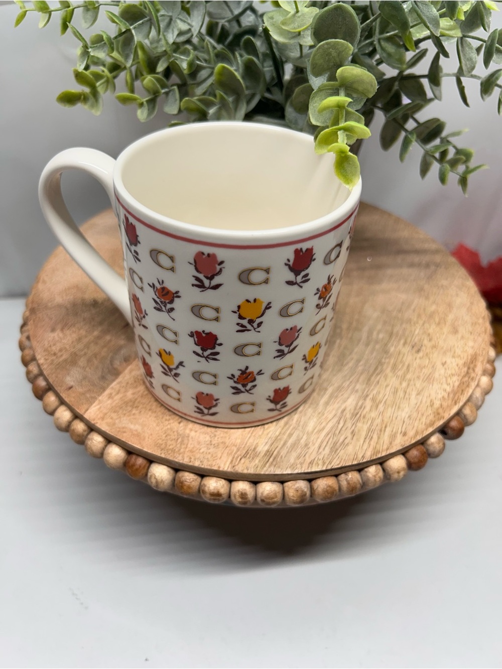 Coach Cream Ceramic Mug with Red and Yellow Floral Motif